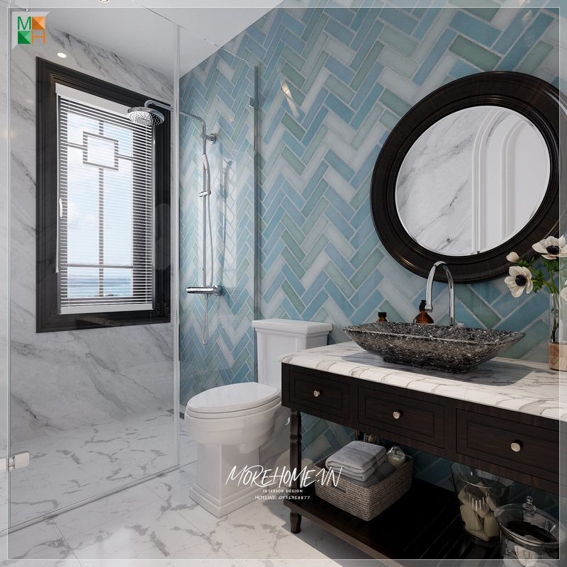 Mẫu thiết kế phòng tắm phong cách Indochine khá lạ mắt ấn tượng nhờ bức tường gạch màu xanh họa tiết xương cá