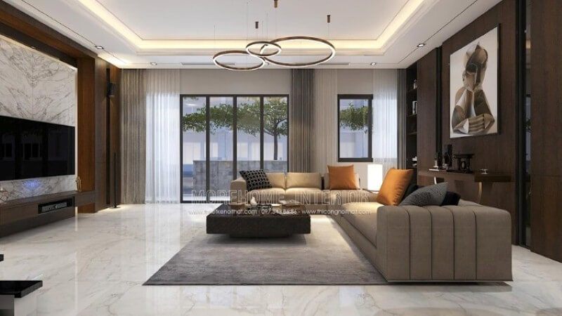 Nếu là người ưa thích sự nhẹ nhàng, một không gian sử dụng gam màu gỗ từ tấm ốp tường cùng màu nâu ghi bộ sofa góc. Bạn có thể tham khảo chi tiết mẫu bố trí biệt thự tại Park City hoặc đa dạng hơn nữa tại website:thietkenoithat.com